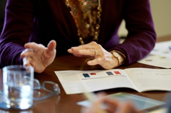 financial advisors hands at conference table